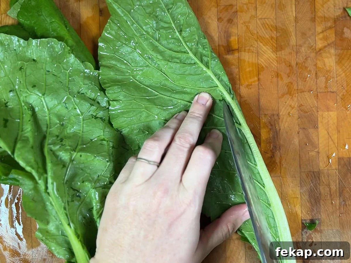 How to Make Southern Turnip Greens 6 Using the tip of a sharp knife to remove the tough center stem from a turnip green leaf.