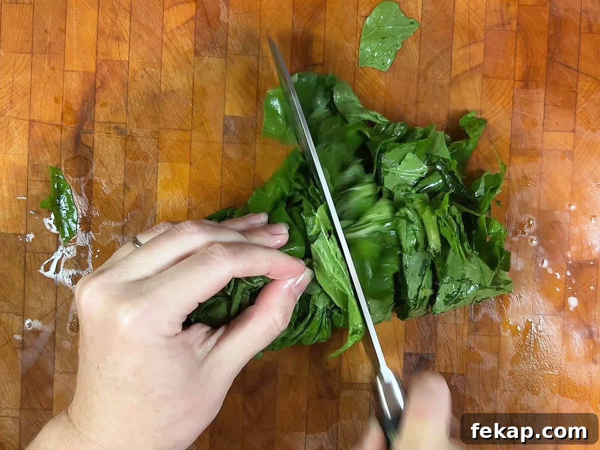 How to Make Southern Turnip Greens 7 Using a sharp knife to cut the turnip green leaves into ribbons.