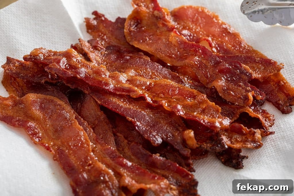 Crispy Oven-Baked Bacon: Perfectly Roasted Every Time 7 Cooked bacon on paper towels