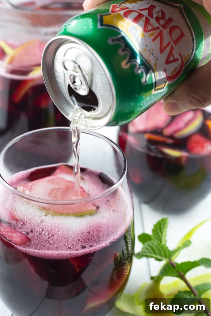 Adding a splash of ginger ale to sangria