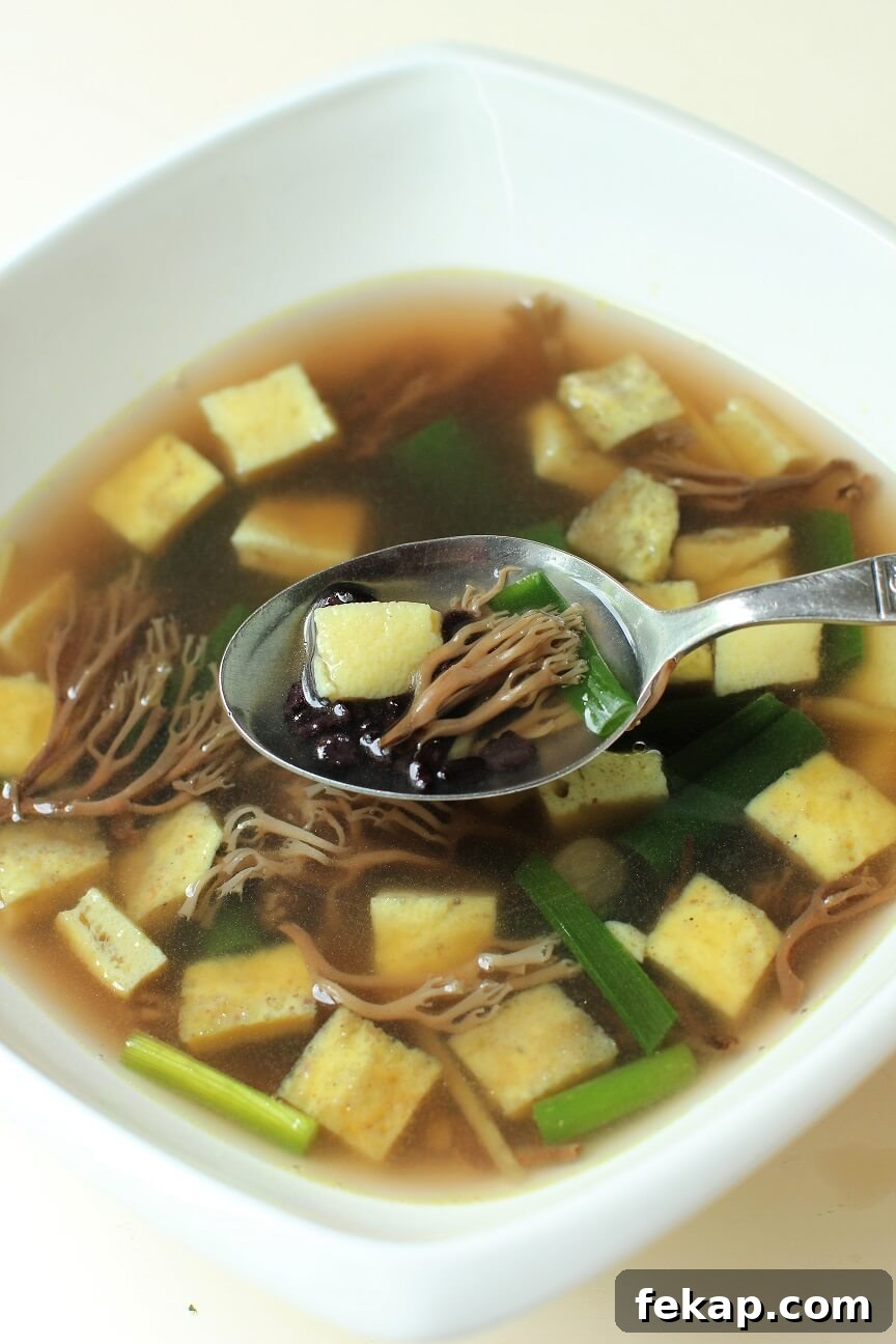 How to Identify and Cook Coral Mushrooms 11 a spoonful of coral mushroom and egg dice soup