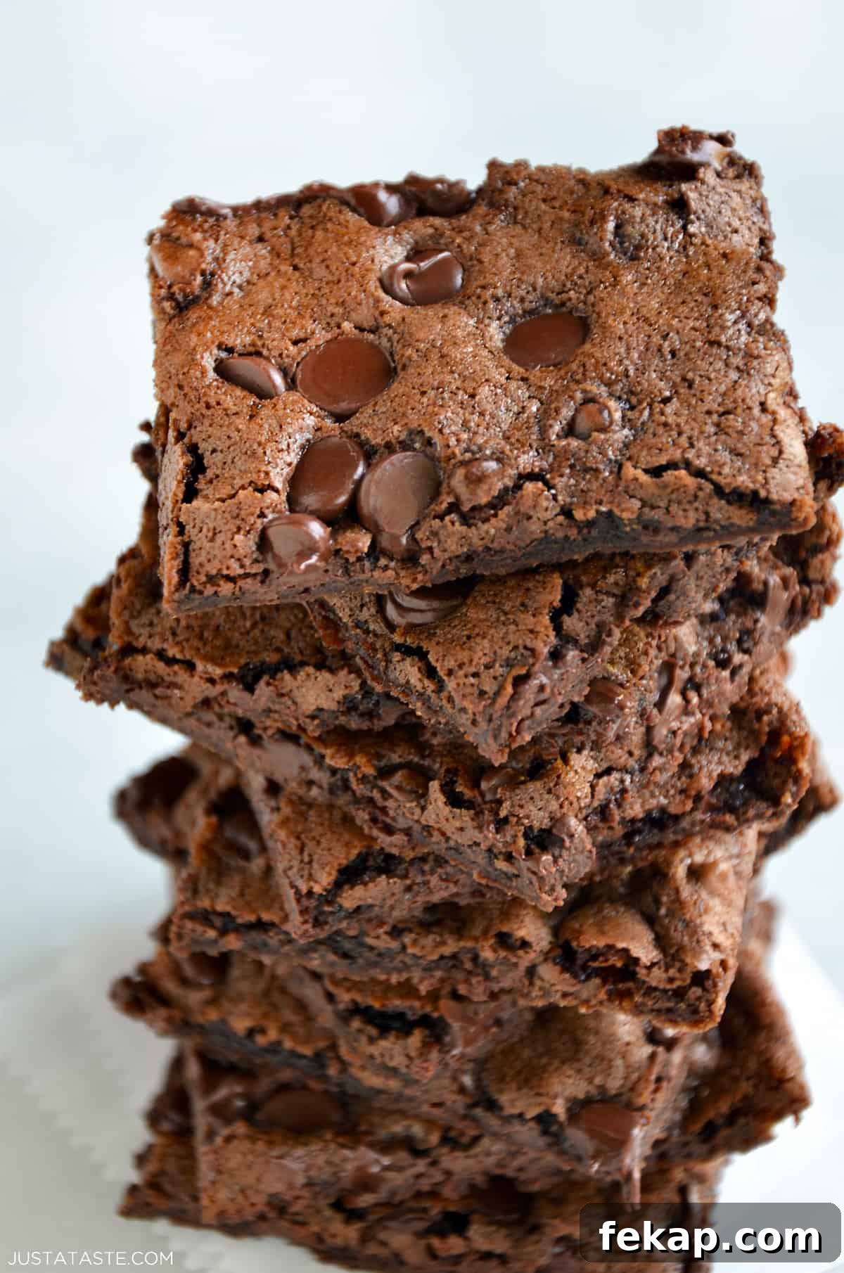 Fudgy Chocolate Brownies Recipe 9 A stack of chocolate chip studded brownie bark.