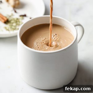 Masala Chai (Tea) being poured into a cup