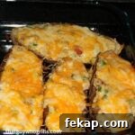 Twice baked potatoes in potato skins on the grill cooking
