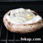 Cheese stuffed portabella mushrooms on the grill