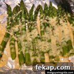 Cheesy Grilled Asparagus on tin foil cooked
