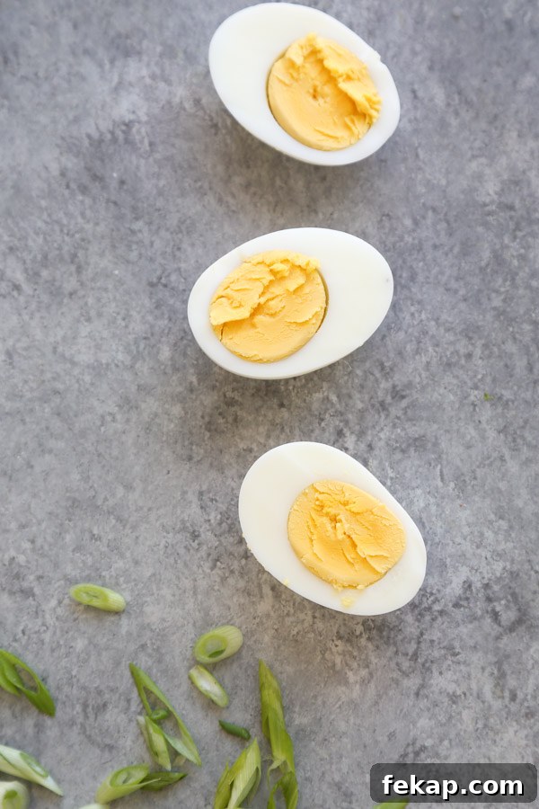 hard boiled eggs halved on a board
