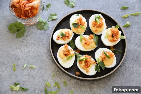 deviled eggs on a plate with herbs