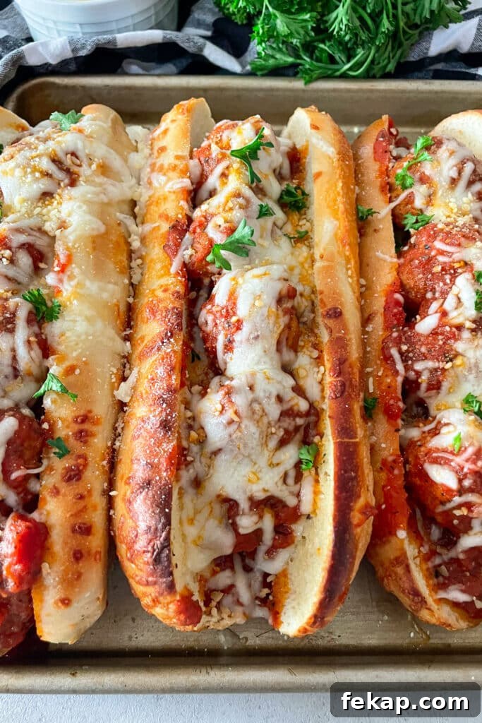 Slow Cooker Italian Meatball Subs Recipe 4 One Italian meatball sub ready to serve with cheese and parsley