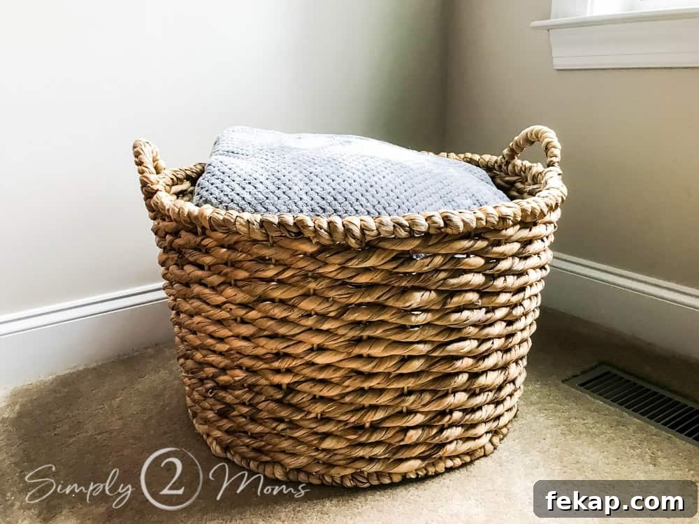 large floor basket filled with blankets
