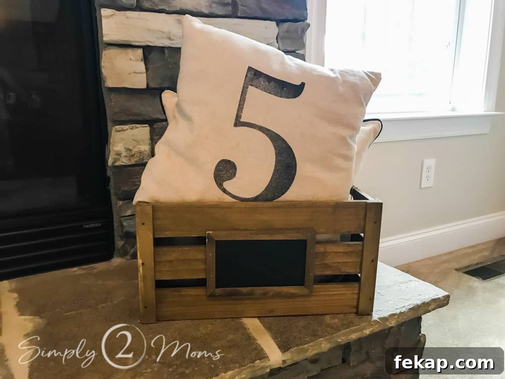 wood box on fireplace hearth with pillows in box