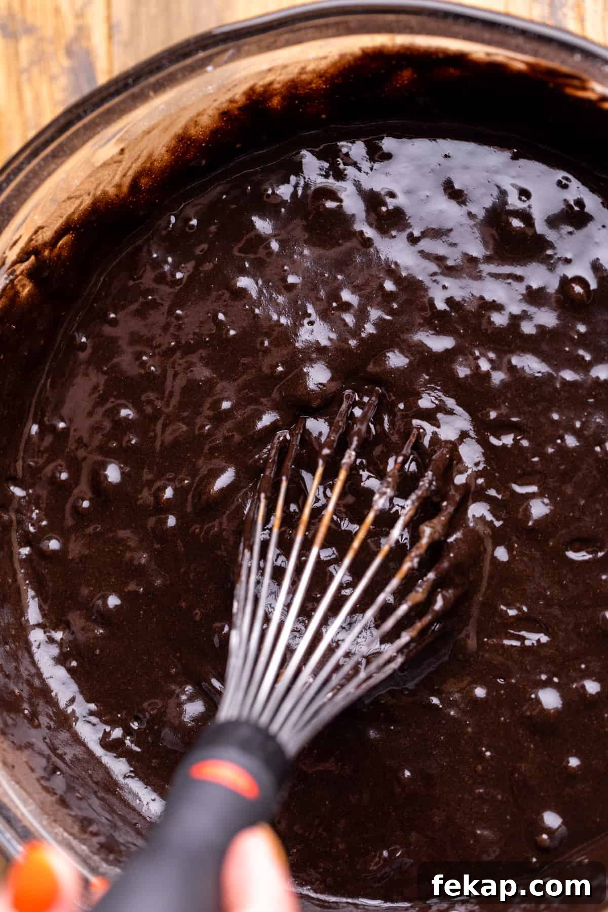 Spooky Halloween Chocolate Cake Recipe 5 Black cake batter in a glass bowl.