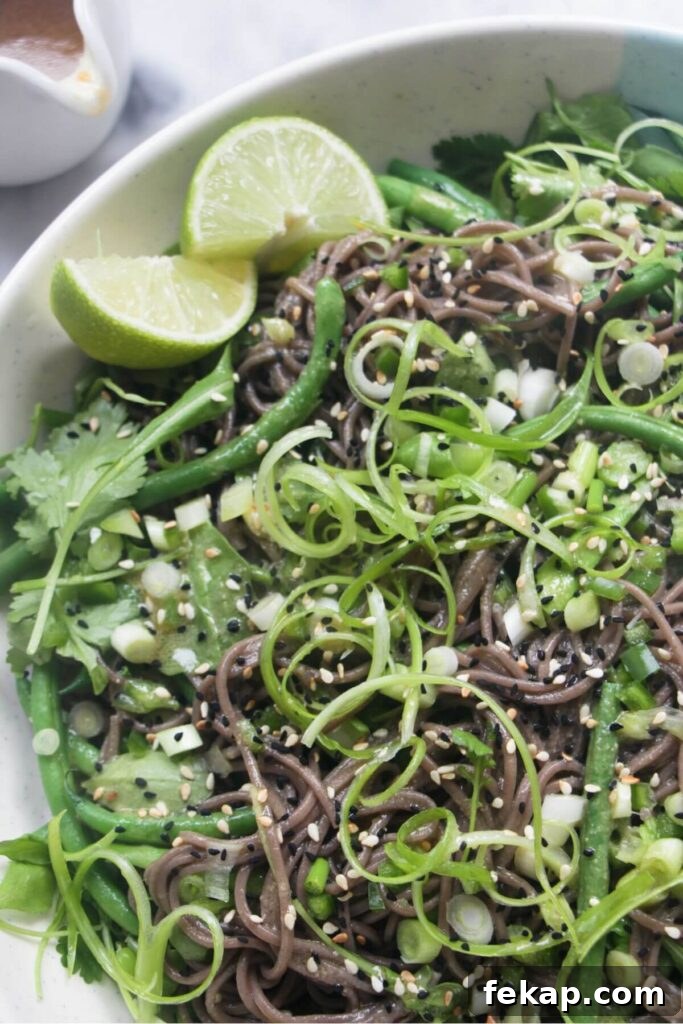Green Goddess Soba Noodle Salad with Creamy Avocado Dressing 9 Close up view of soba noodle salad with lots of green vegetables in it.