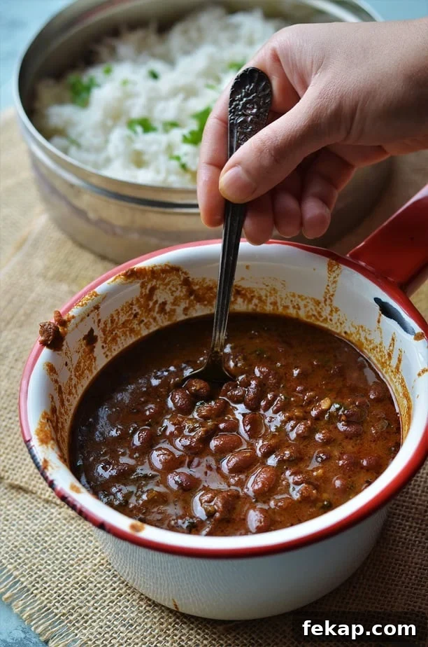 Instant Pot Rajma Chawal recipe is served in a white saucepan with red rim