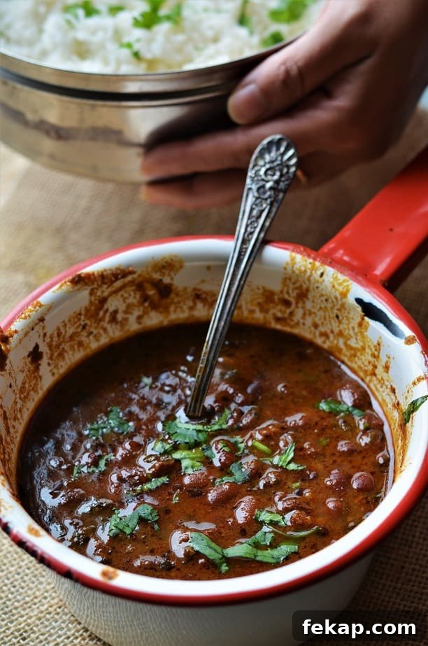Instant Pot Rajma curry recipe cooked in a spicy sauce & garnished with chopped cilantro