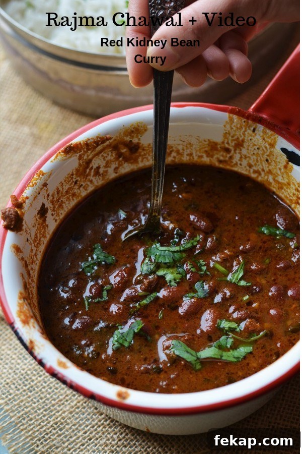 Instant Pot Rajma masala served in a red rimmed white saucepan