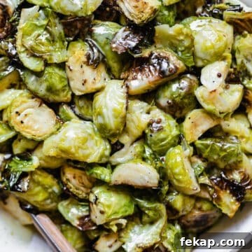 Creamy honey mustard roasted Brussels sprouts in a white bowl