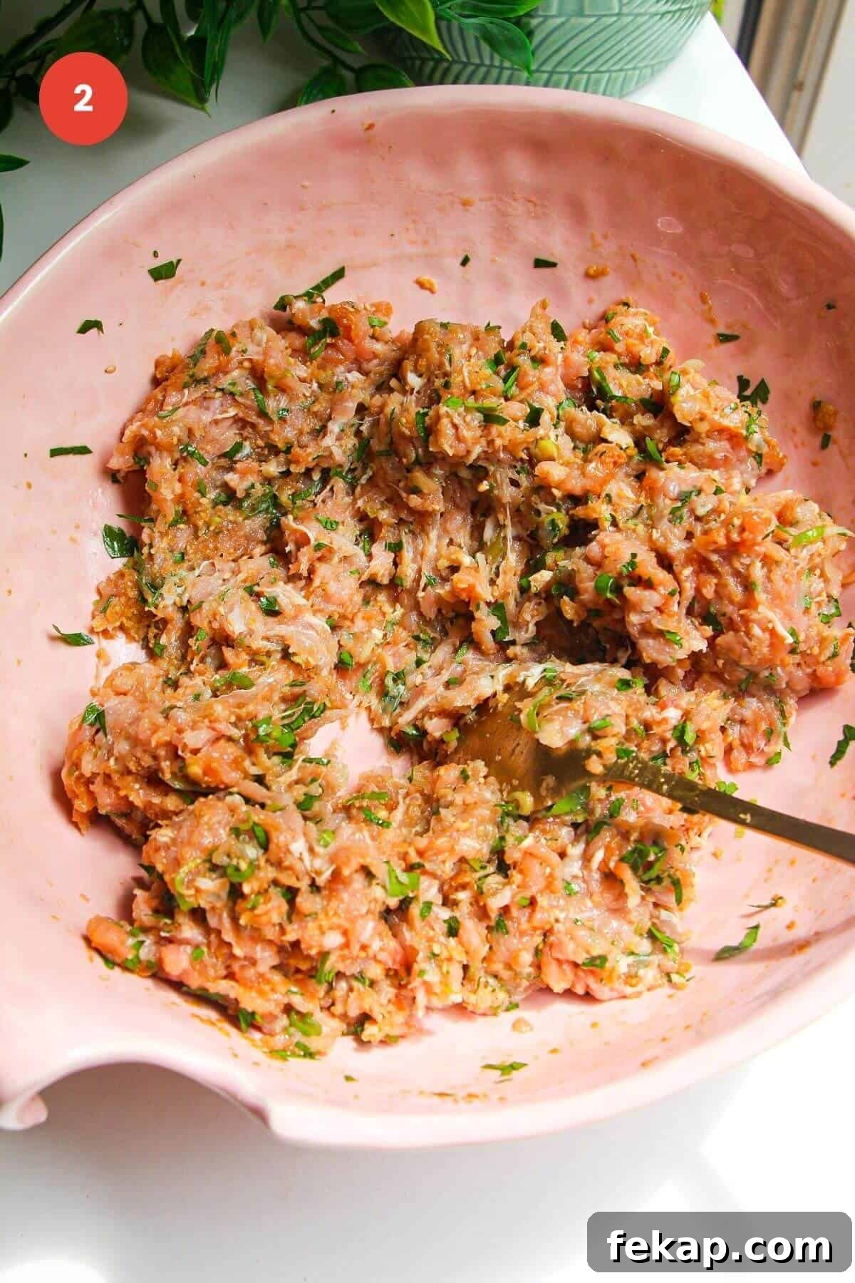 Dumpling meatball mixture mixed.