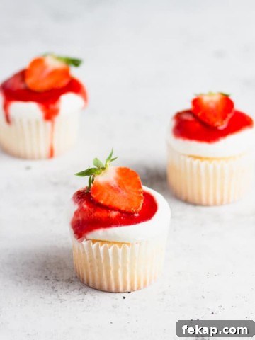 close up photo of three strawberry shortcake cupcakes
