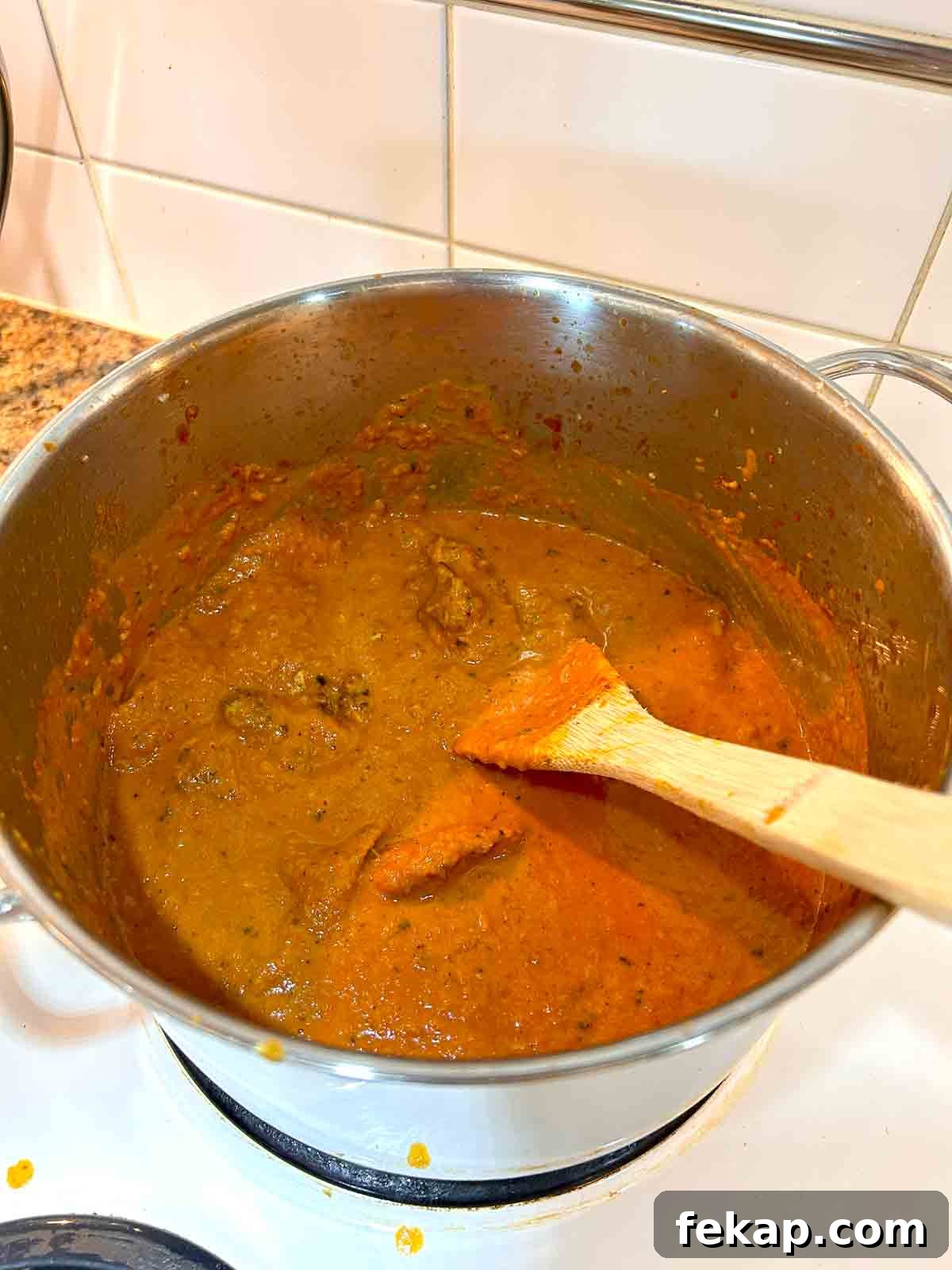 Creamy Butter Chicken Recipe: Authentic Indian Flavor 9 cream, kasoori methi, and chicken added to pot.