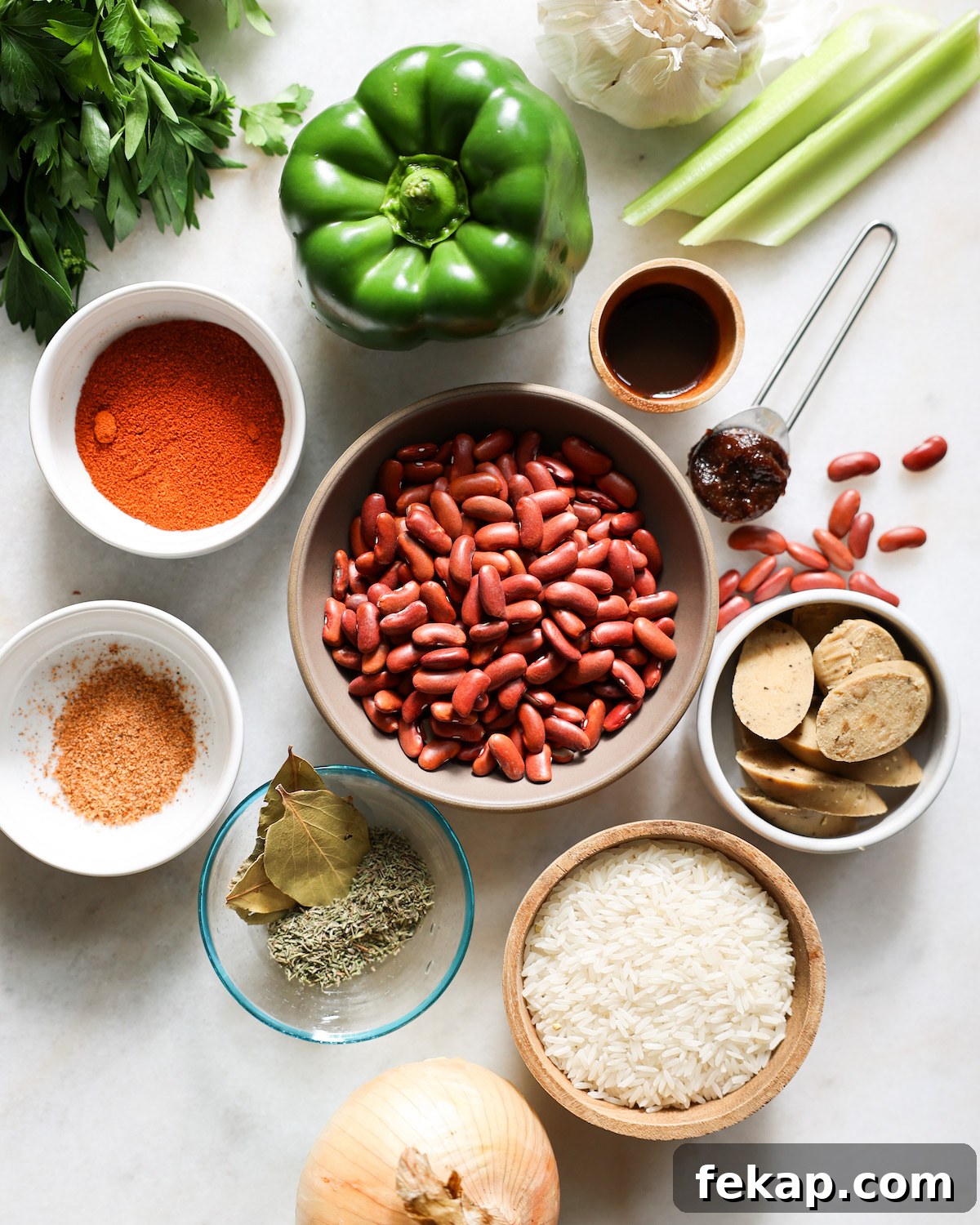 ingredients for red beans and rice on a white counter