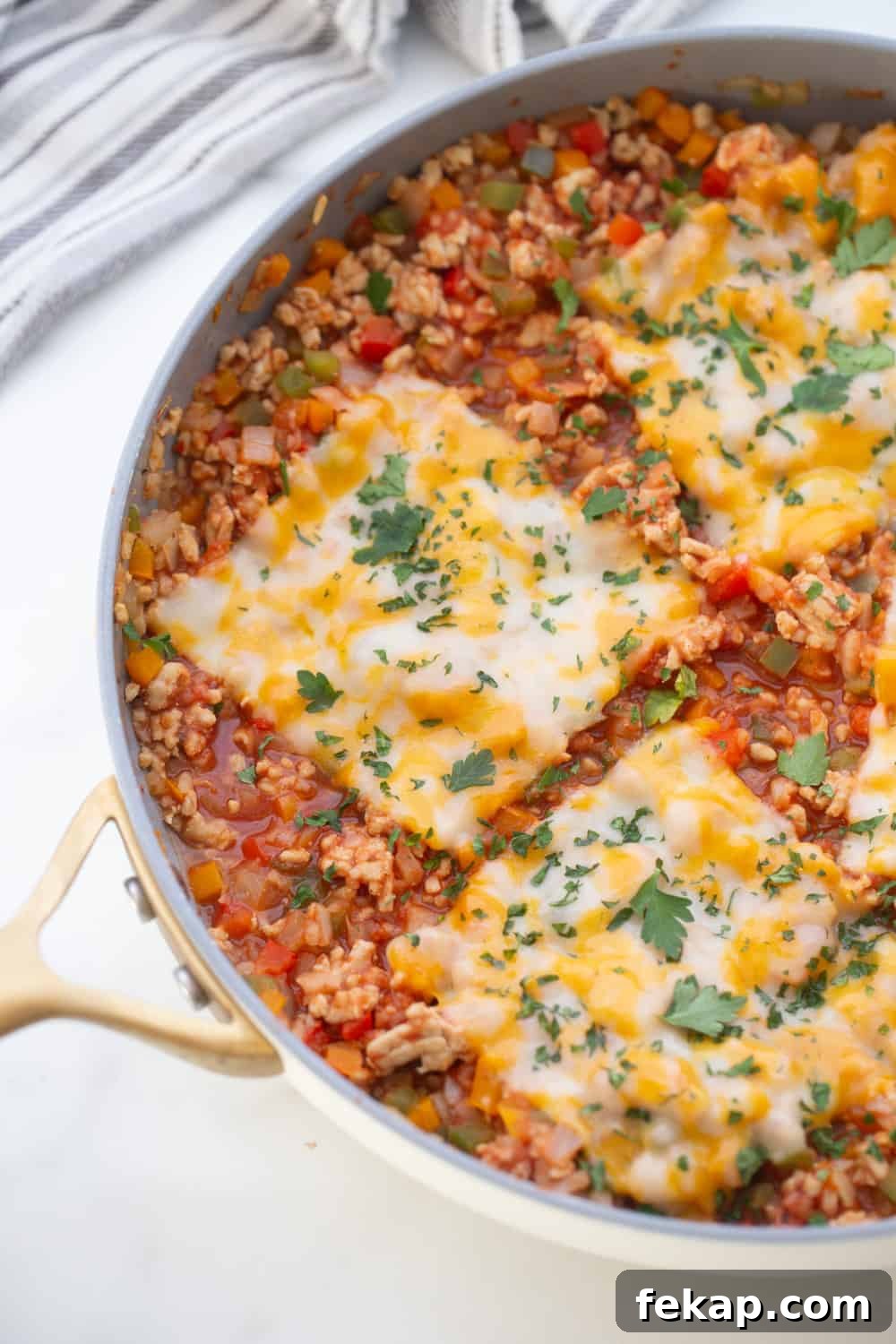 One Pan Stuffed Pepper Skillet Recipe 11 Stuffed pepper skillet with melted Monterey Jack cheese in a skillet.