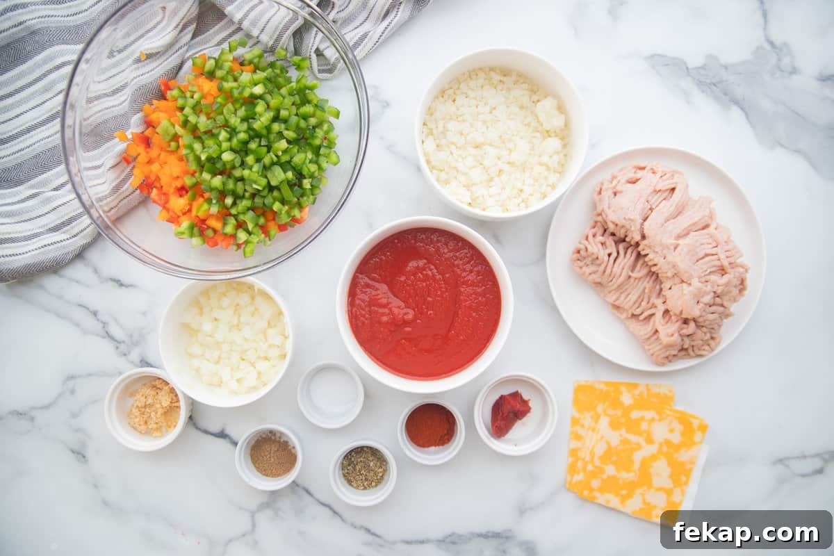 One Pan Stuffed Pepper Skillet Recipe 4 Ingredients for stuffed pepper skillet with ground chicken, bell peppers, tomato sauce, and cauliflower rice.