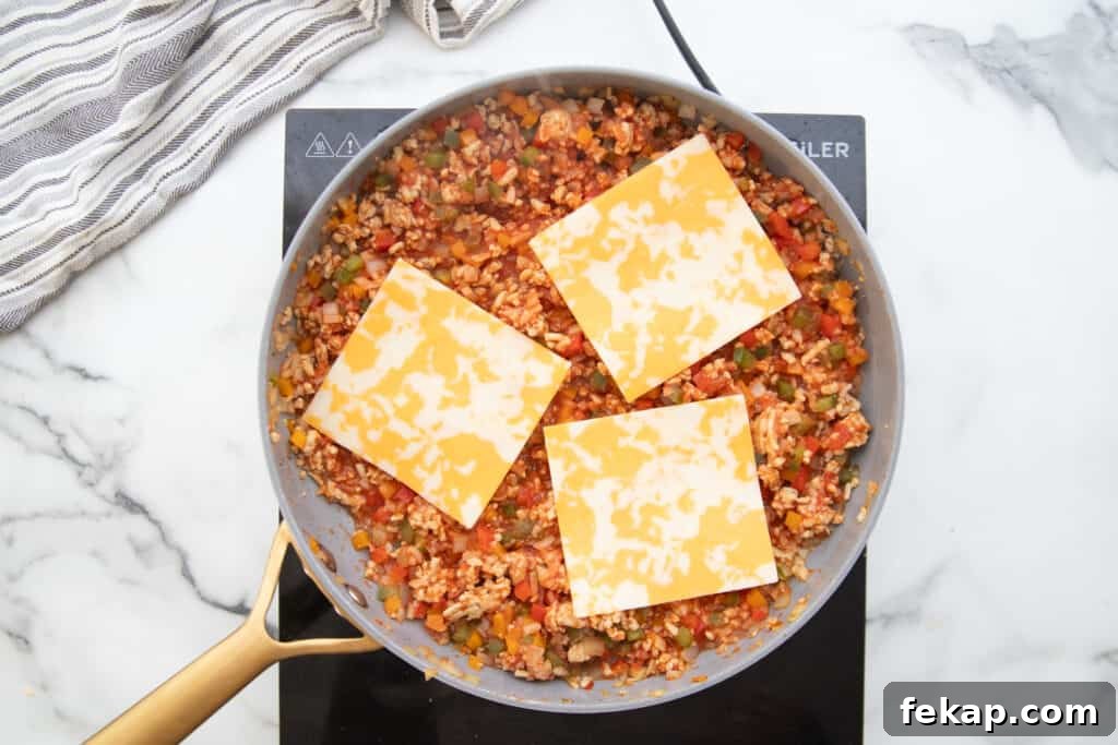 One Pan Stuffed Pepper Skillet Recipe 9 Stuffed pepper skillet topped with slices of Monterey Jack cheese.