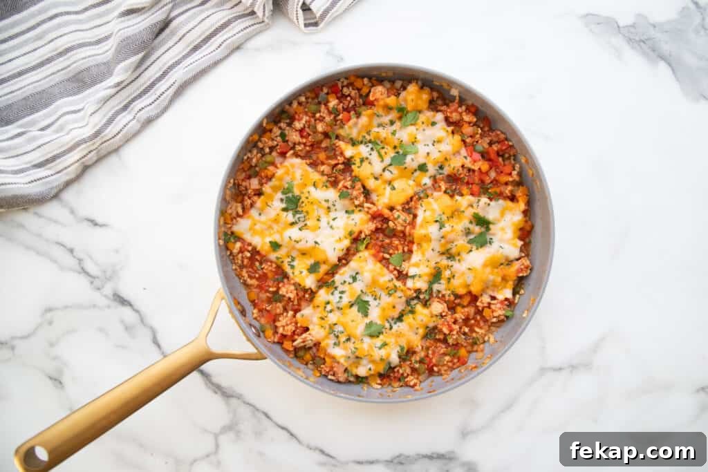 One Pan Stuffed Pepper Skillet Recipe 10 Finished stuffed pepper skillet with melted cheese.