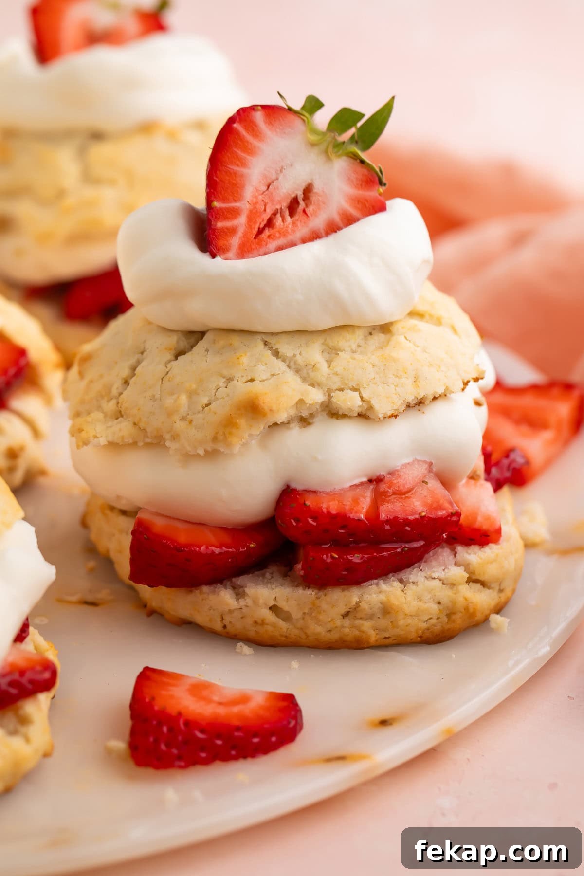 Vegan Strawberry Shortcake Recipe from Scratch 2 Vegan strawberry shortcake made with biscuits, sliced strawberries, and cream.