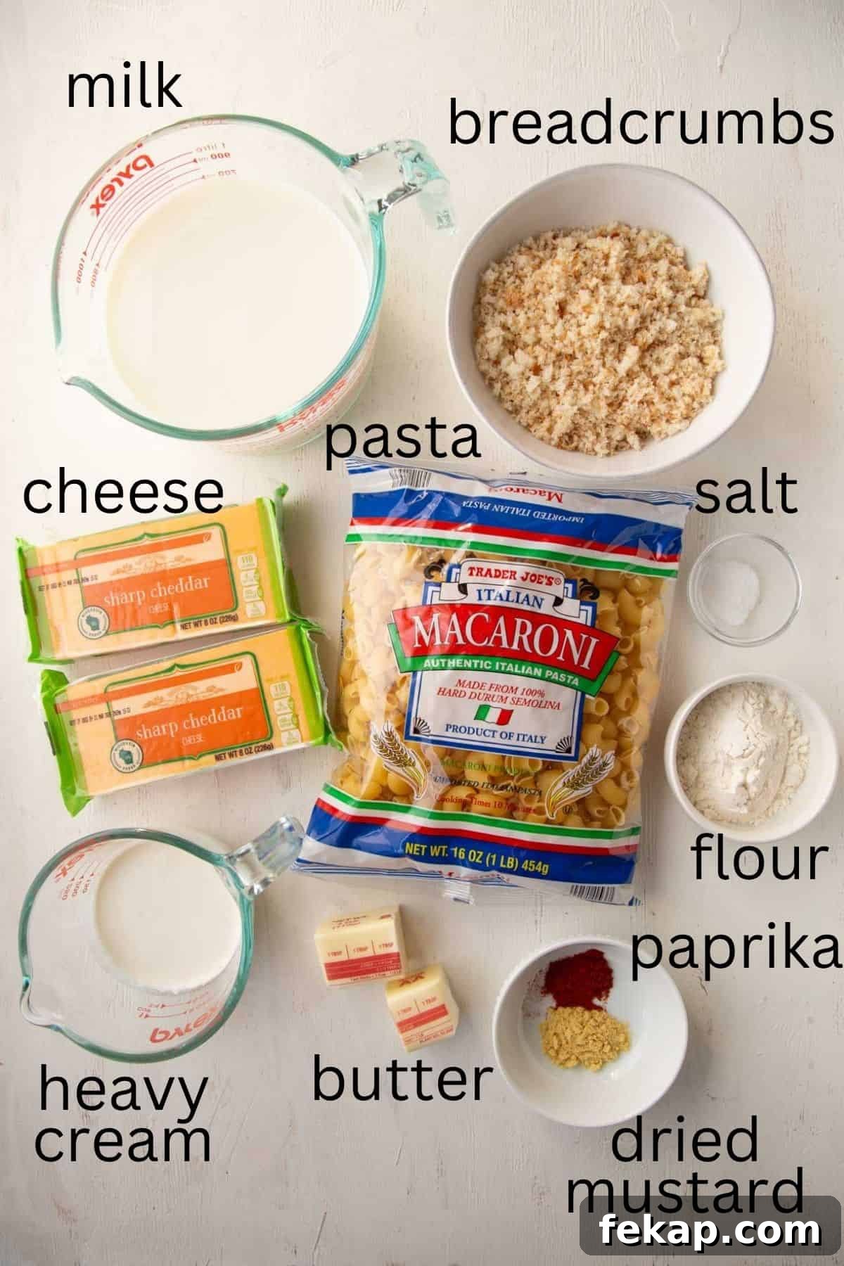 Creamy Old Fashioned Mac and Cheese Recipe 4 pasta, blocks of sharp cheddar, milk, cream, and other ingredients.