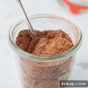 A jar of cajun seasoning mix.