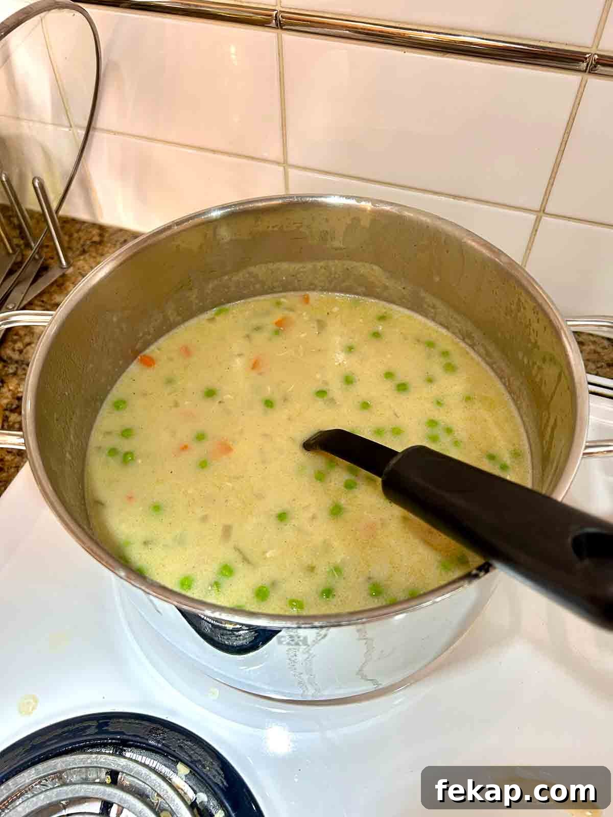 chicken, peas, and cream added to broth.