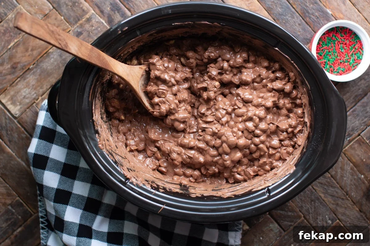 Slow Cooker Peanut Clusters Recipe 6 melted chocolate and peanuts in a slow cooker
