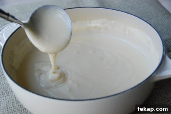 Quick Weeknight Mornay Cheese Sauce Recipe 4 mornay sauce in pot.