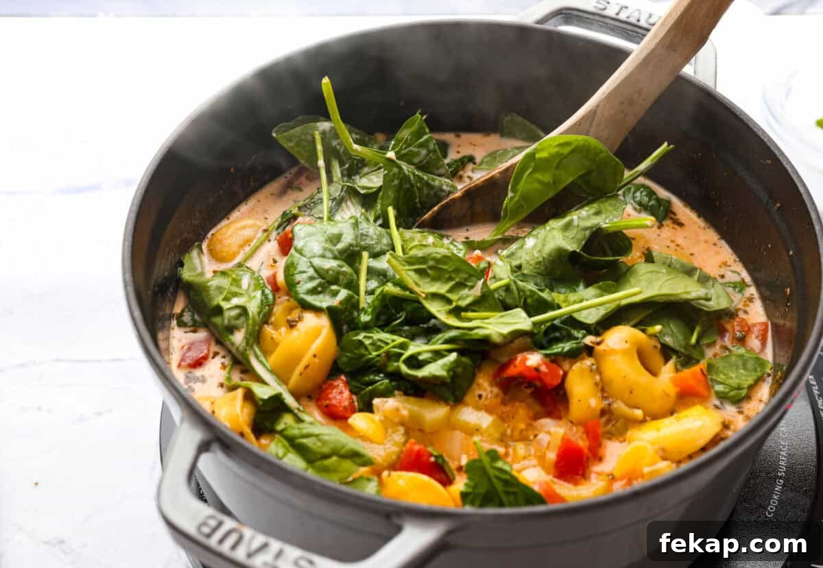 Cream, cheese and spinach added to the soup.