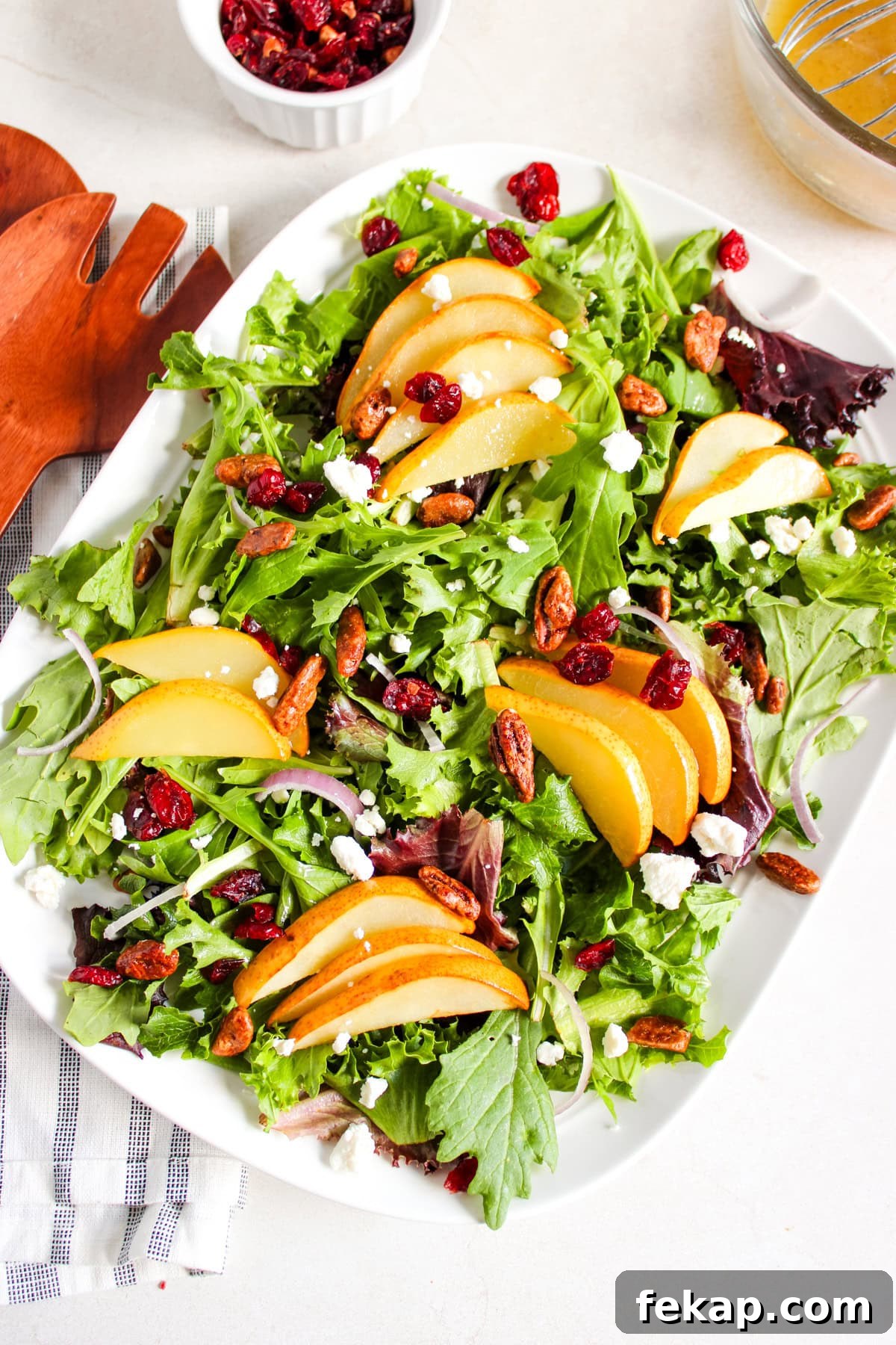 Roasted Pear Salad with Goat Cheese and Walnuts 2 An overhead image of roasted pear salad on a plate.