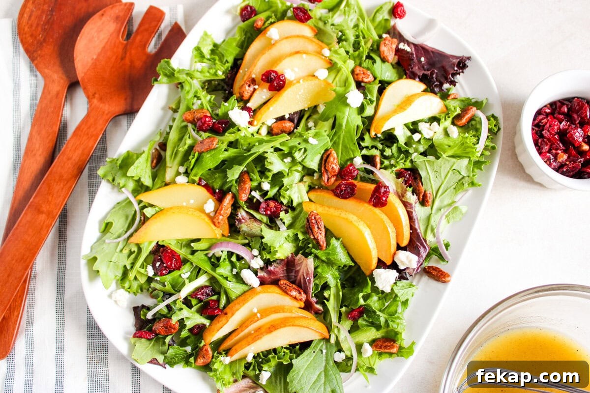 Roasted Pear Salad with Goat Cheese and Walnuts 5 An overhead image of roasted pear salad on a serving plate.