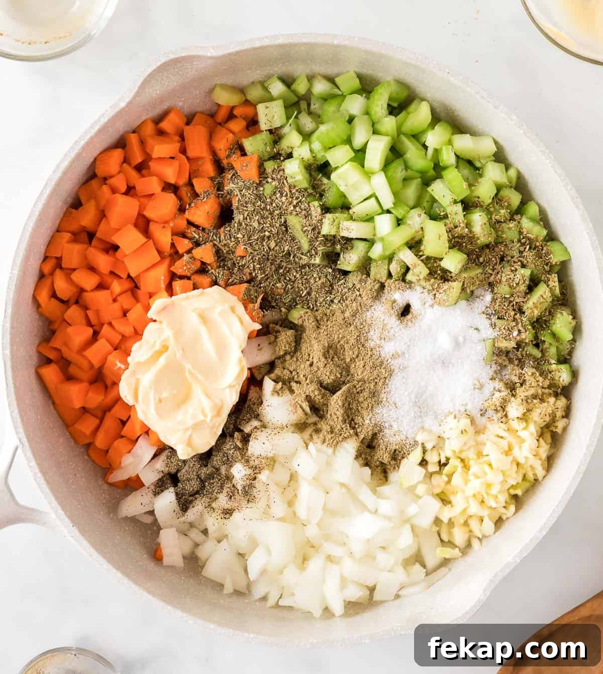 adding vegan butter and spices to the vegetables