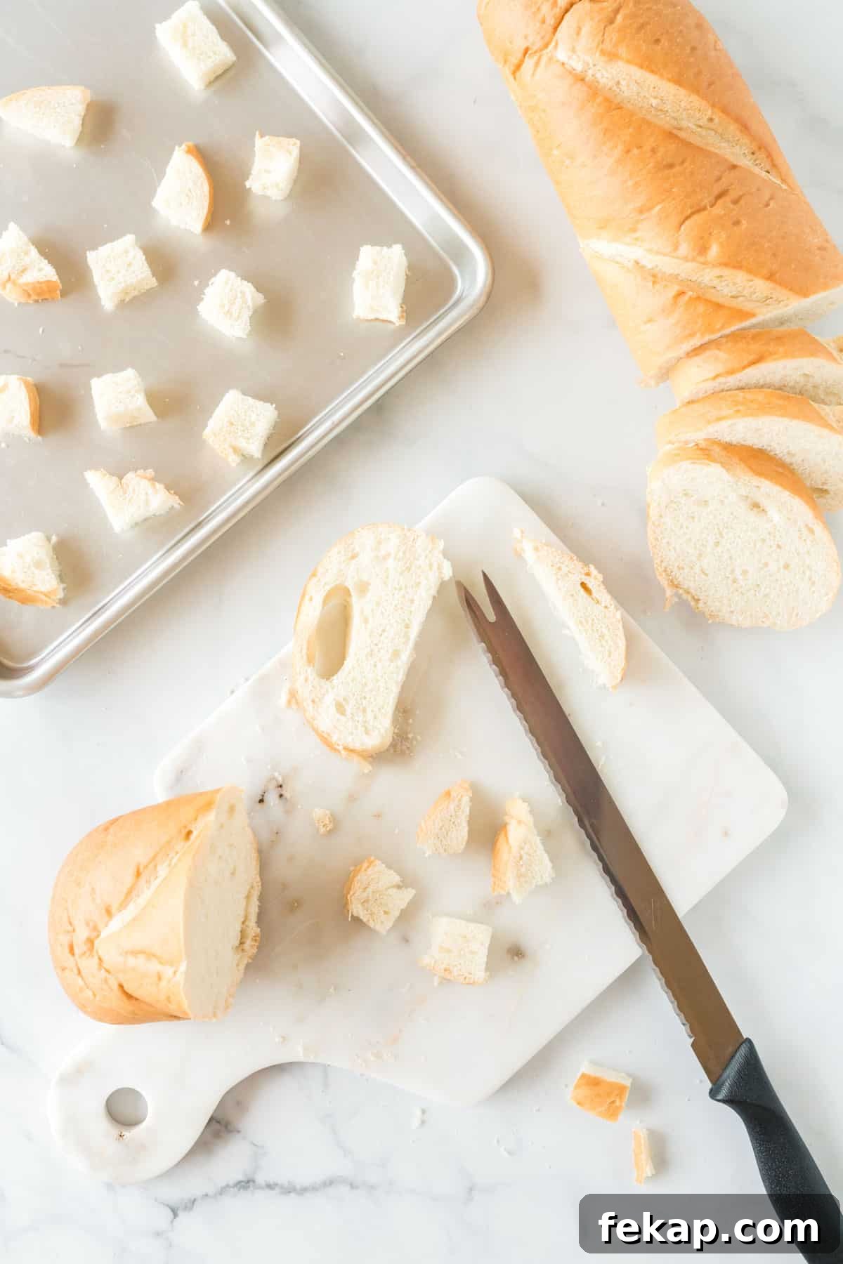 cutting a loaf of bread into cubes