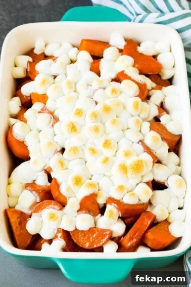 Smoked Turkey Rub Recipe for Juicy Flavorful Turkey 8 A pan of candied yams topped with marshmallows.