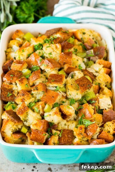 Smoked Turkey Rub Recipe for Juicy Flavorful Turkey 10 Thanksgiving stuffing in a baking dish, topped with parsley.