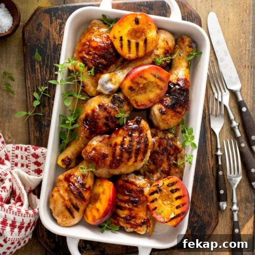 Grilled Chicken with Sticky Peach Glaze 12 Ceramic white pan filled with peach glazed grilled bone-in chicken pieces.