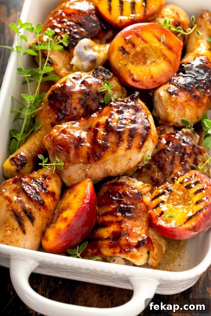 Grilled Chicken with Sticky Peach Glaze 4 Juicy and sticky glazed chicken legs and thighs in a white ceramic pan