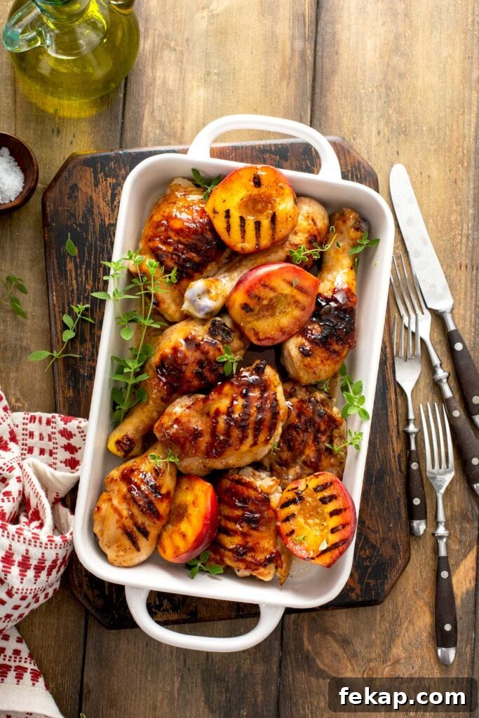 Grilled Chicken with Sticky Peach Glaze 10 Sticky grilled chicken legs, thighs and grilled peaches in a white baking pan