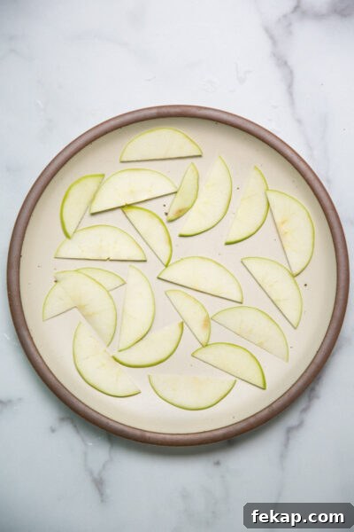 sliced green apples on a plate