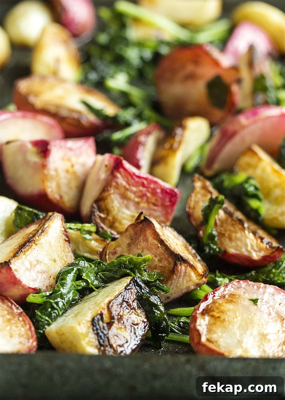 Roasted Hakurei Turnips and Radishes Recipe 3 Roasted Turnips and Radishes - Sweet Hakurei turnips and young radishes are tossed with olive oil and roasted with their greens in this simple and satisfying side dish.
