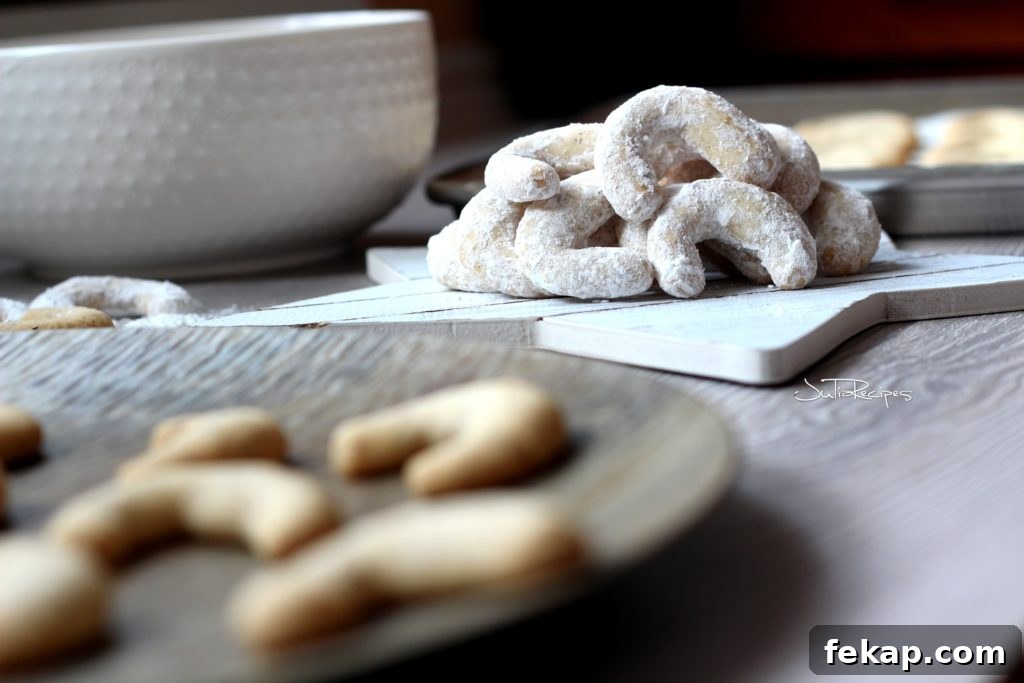 Vanilla Hazelnut Crescent Cookies 4 close up on hazelnut crescents covered in icing sugar