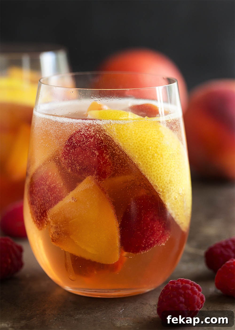 This sparkling white peach sangria is super easy to mix together and just as easy to enjoy on a warm day. Not too sweet and full of fizz from the bubbly, it's the taste of summer in a glass!