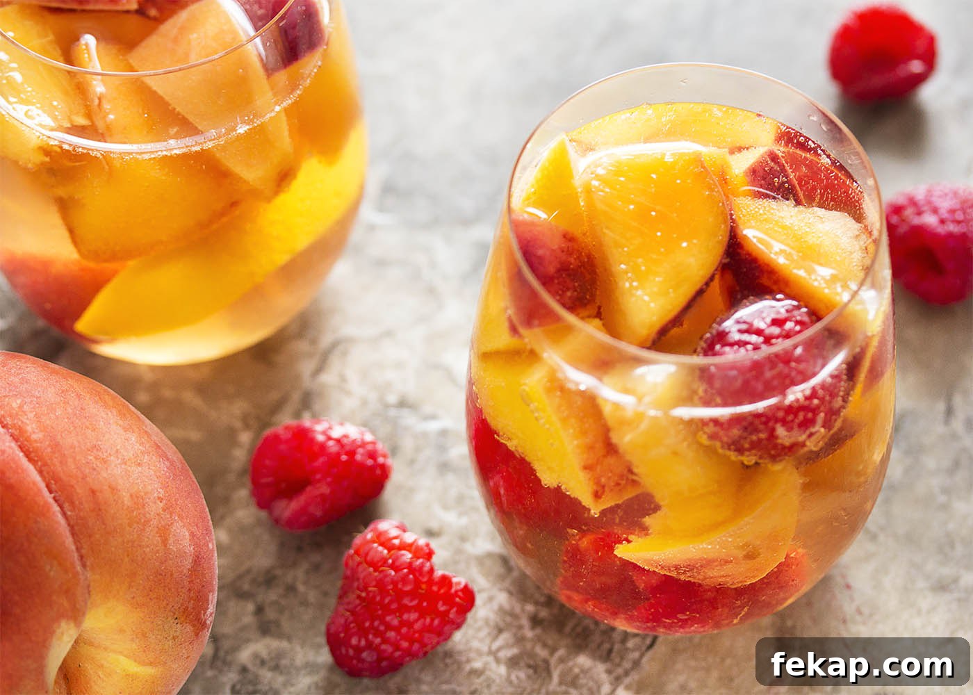This sparkling white peach sangria is super easy to mix together and just as easy to enjoy on a warm day. Not too sweet and full of fizz from the bubbly, it's the taste of summer in a glass!